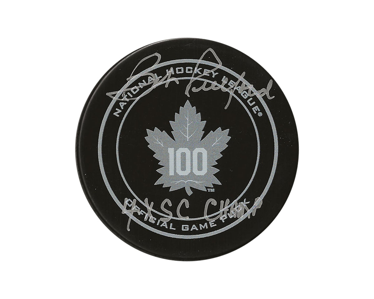 Disco oficial de juego del centenario de los Toronto Maple Leafs autografiado por Bob Pulford con la inscripción "4x SC Champ"